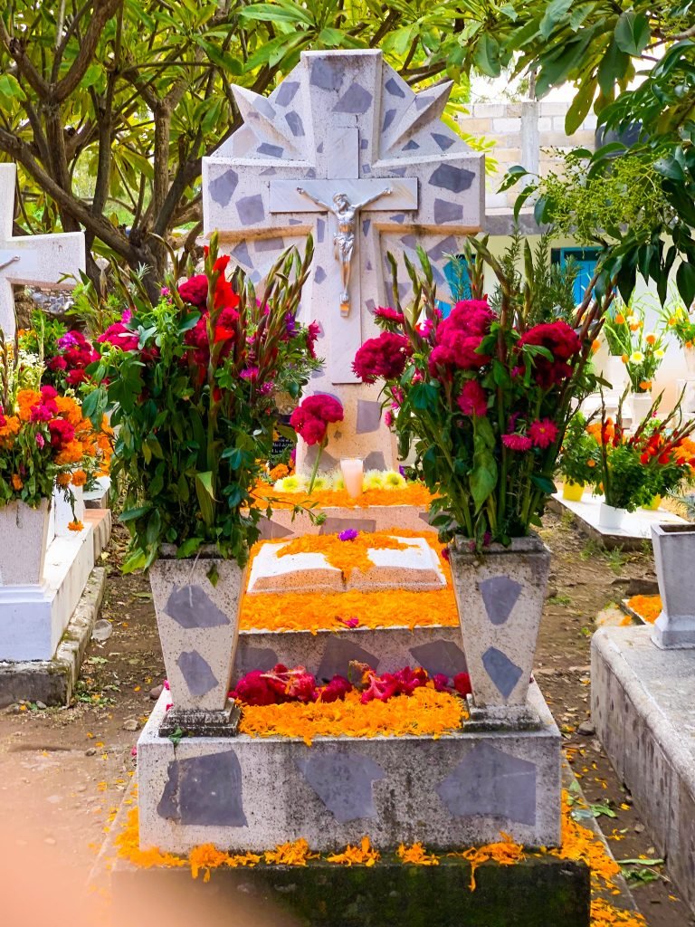 Decorated cemetery grave with marigold flowers for Day of the Dead celebration