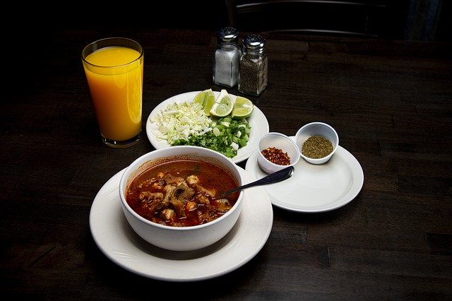 Traditional Mexican soup with fresh ingredients and garnishes